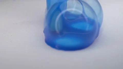 Blue paint is inflated on paper. Bubbles from blue paint macro. Stock Footage 236475782