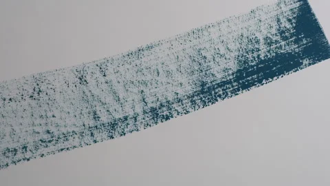 Blue paint painted onto wall with brush Stock Footage 260345376