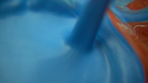 Blue Paint Poured Into Red Paint Stock Footage 94360096