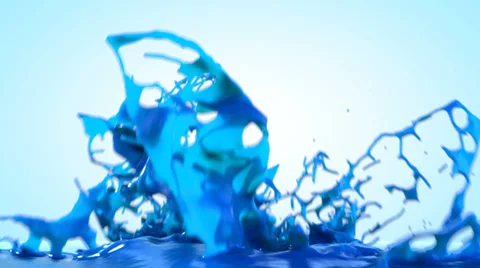 Blue paint splashing, isolated on bright backgorund Stock Footage 38908377