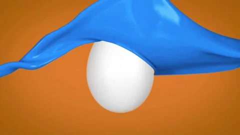 Blue paint splashing onto white egg decorating process slow motion Stock Footage 327594292