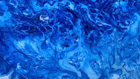 Blue paint texture splash, leaking macro Stock Footage