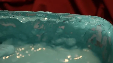 Blue paint is wiped on the side of a pot of paint Stock-Footage 101165913
