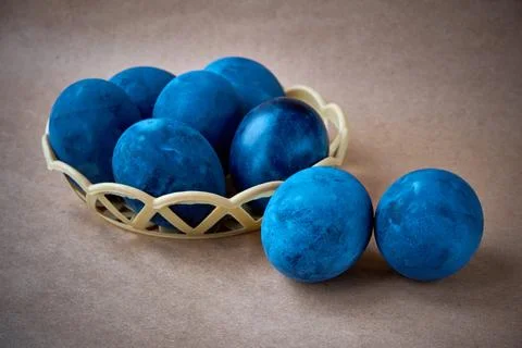 Blue painted eggs on a paper background Stock Photos