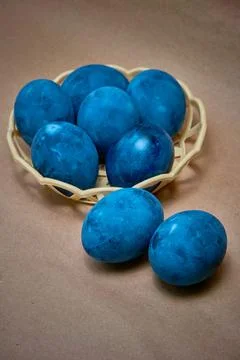 Blue painted eggs on a paper background Stock Photos