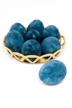 Blue painted eggs on a white background, vertical shot Stock Photos