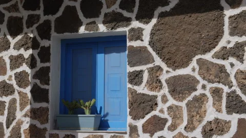 Blue painted window shutters in the old Harbour in El Cotillo Stock Footage 302308591