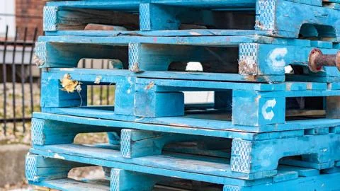 Blue Pallets piled up Stock Photos