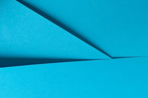 Blue paper background with a smooth matte finish and a subtle gradient. Brigh 스톡 사진