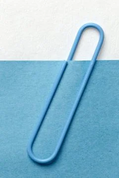 Blue paper clip on note Stock Photos