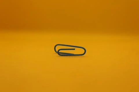 Blue paper clip. Stock Photos