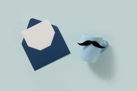 Blue paper envelope on blue background. View from above. Stock Photos