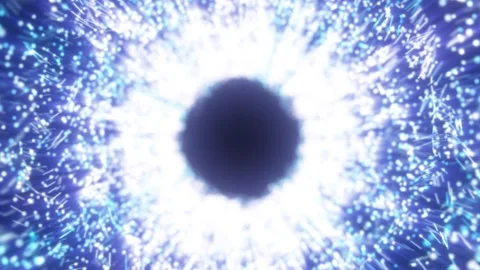 Blue particle explosion forming a luminous vortex with dark center Stock Footage 328665640