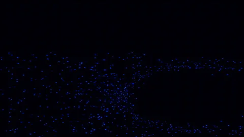 Blue Particle Swarm Forming Circular Void on Dark Background Video stock 342628846