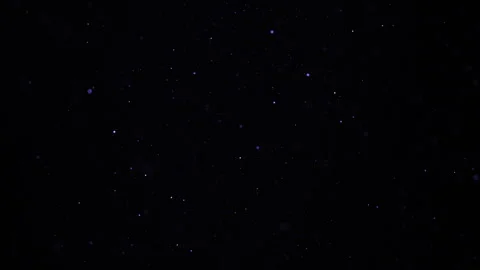Blue particles and dust floating on a bl... | Stock Video | Pond5