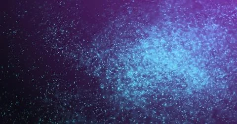 Blue particles floating and glowing, creating magical image effect Stock Photos