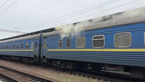 Blue Passenger Train Standing On Railway Tracks At Urban Station Platform Vídeo Stock 335193307