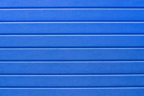 Blue pattern of horizontal lines, covering, background, abstraction, close-up Stock Photos