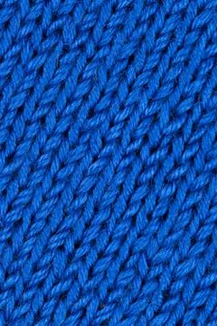 Blue patterned knitted fabric Stock Photos