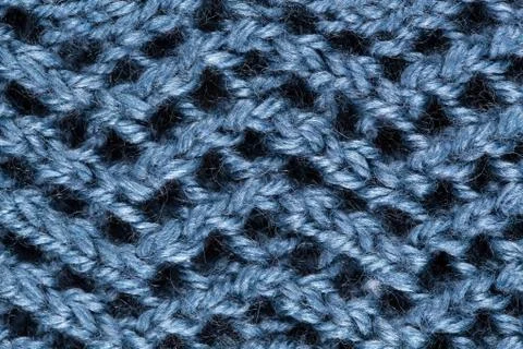 Blue patterned knitted fabric Stock Photos