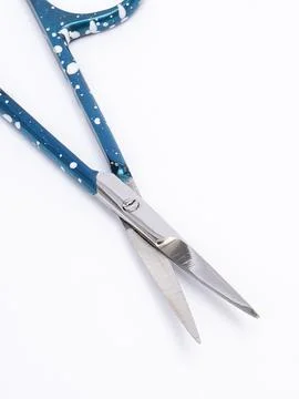 Blue patterned nail scissors open Foto stock