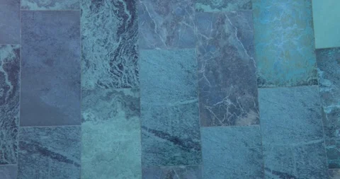 Blue patterned tiles laid at bottom of swimming pool Stock Footage 252204158
