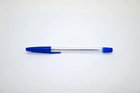 Blue pen with cap on white background, stationery concept, Copy Space Fotos de archivo