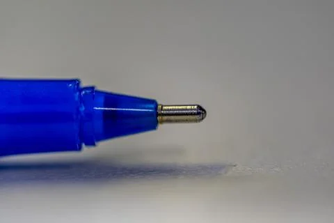 A blue pen with a silver tip is shown in the image Stock-Fotos