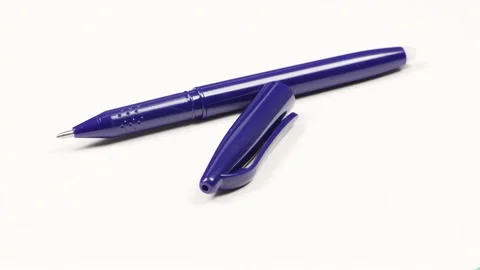 A blue pen on a white background. Side view. Stock Footage 221126614