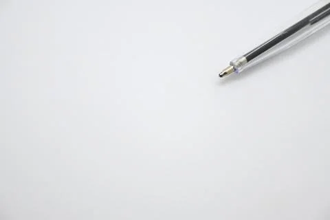 Blue pen without cap on white background, openness and vulnerability concept, Co Stockfoto's