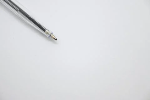 Blue pen without cap on white background, openness and vulnerability concept, Co Photos