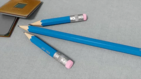 Blue Pencils And CPU Chips Together On Gray Surface Stock-Footage 331321970