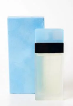 Blue perfume bottle closeup Stock Photos