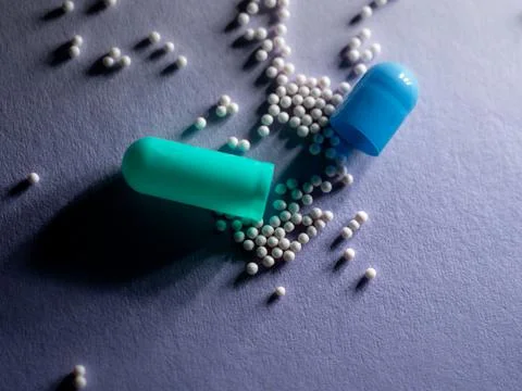 Blue Pill capsule isolated. Macro close up Stock Photos