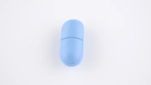 Blue pill isolated on white background, rotation Stock-Footage 229550057