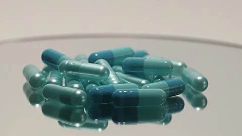 Blue pill on the turntable Stock Footage 249972748