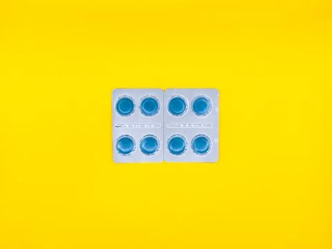 A blue pill on a white background. copy space, flay lay, top view Stock Photos