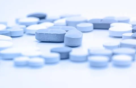 Blue pills for male impotence. Concept of erectile dysfunction in men post CO Stock Photos