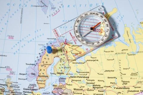 Blue pin and compass on map pointing sweden Stock Photos