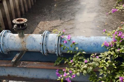 Blue Pipe of  opencast sewer system in Jakarta indonesia Stock Photos