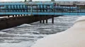 Blue pipelines with oxygen supplying under water and foam on surface HD Footage