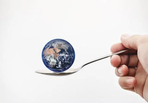 Blue planet earth on spoon. Elements of this image are furnished by NASA Stock Photos