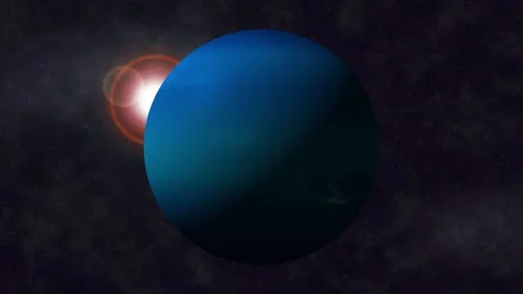 Blue planet floating in dark space with bright sun flare and starry backgroun Stock Footage 340390059