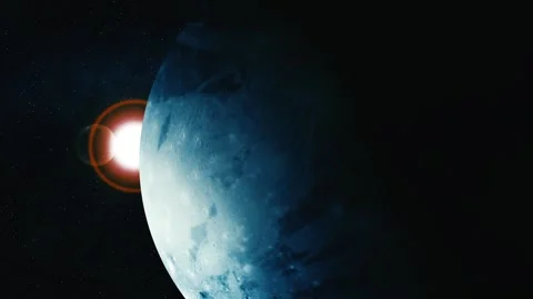 Blue planet or moon in dark space with bright sun flare behind it Stock Footage 340382809