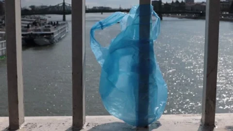 Blue Plastic bag hanging on the railing Stock-Footage 273585954
