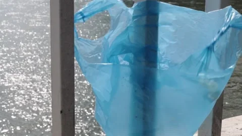 Blue Plastic bag hanging on the railing Stock-Footage 273585955