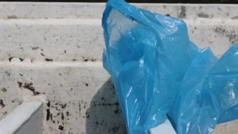 Blue Plastic bag hanging on the railing Video stock 273586015