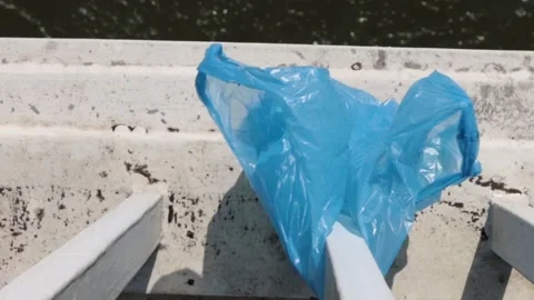 Blue Plastic bag hanging on the railing Video stock 273586019