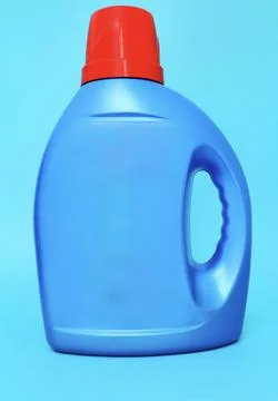 Blue plastic bottle of laundry detergent close up Stock Photos