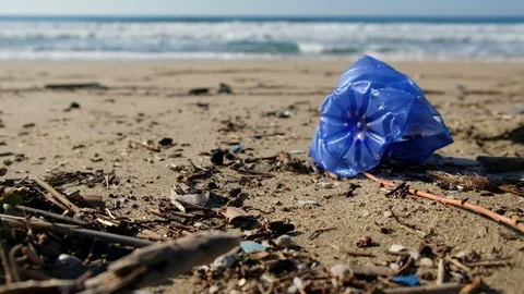 Blue Plastic bottle on sea ecosystem over blurred waves motion,planet save 4k Stock Footage 120444863